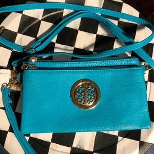 Turquoise handbag with gold tree of life  logo